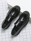 Men's houndstooth tassel loafers in glossy black