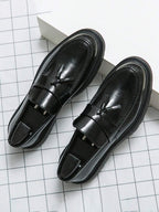 Men's houndstooth tassel loafers in glossy black