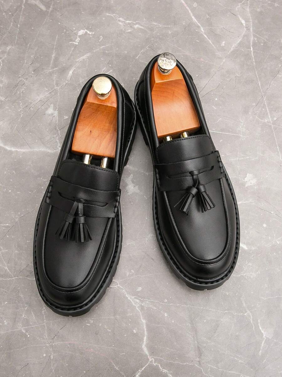 Men's houndstooth tassel loafers in matte black — detail view